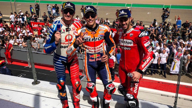 Marc Marquez (tengah) bersama Jack Miller dan Andrea Dovizioso