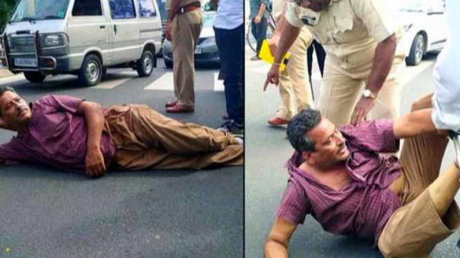 Pria terlentang di jalanan tak terima ditilang.