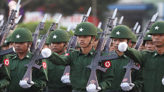 Soldiers march during a Union day celebration in Yangon