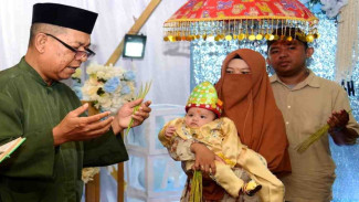 Mohuntingo Adat Potong Rambut Bayi di Gorontalo Simbol Doa dan Perlindungan