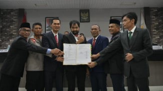 Sistem Kebijakan Adat dalam Qanun Aceh