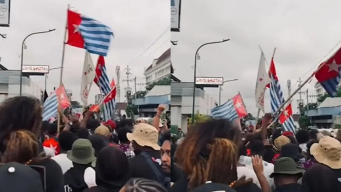 Aliansi Mahasiswa Papua (AMP) mengibarkan bendera OPM