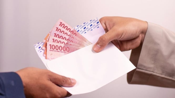 Ilustrasi uang pencairan KJMU 2025