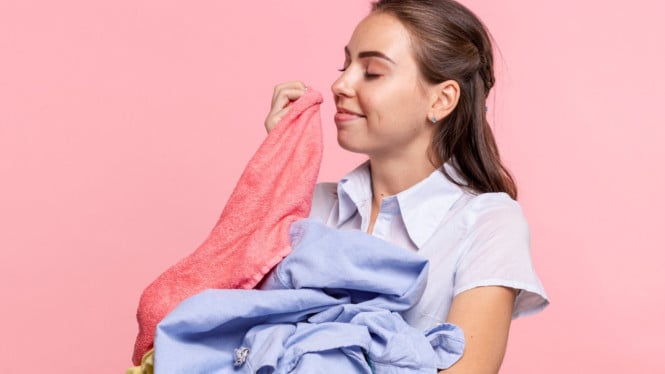 Ilustrasi mencuci baju yang wangi ala laundry