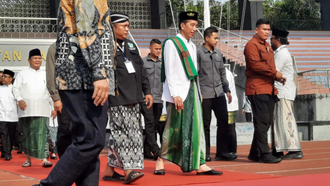 Presiden Jokowi dan Prabowo Subianto di Acara HSN di Surabaya.