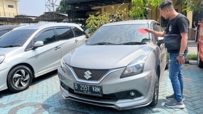 Suzuki Baleno B 2557 KOM milik korban