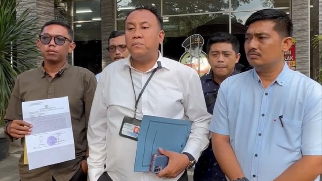 Henry Pakpahan SH, selaku Tim Hukum DPW 234 SC Sumut saat melaporkan ke Polda Sumut.