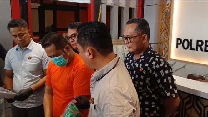 Driver ojol, Taufik Hidayat, tersangka penyebaran informasi bohong.