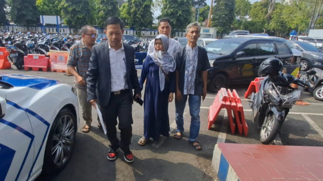 Suroso dan Sutiwarti saat datang ke Polresta Banyumas.