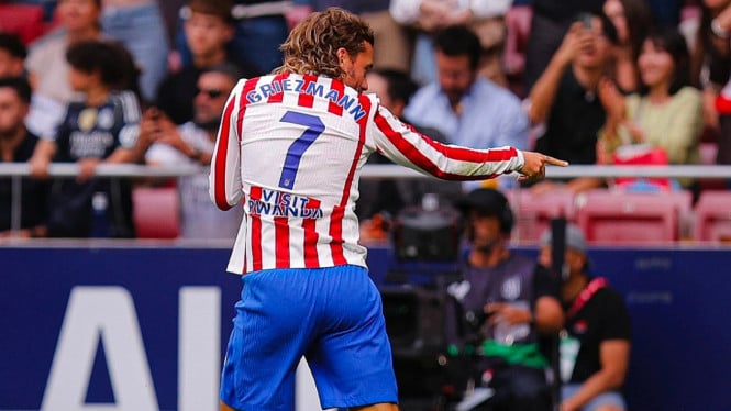 Griezman rayakan gol ke gawang Real Madrid.