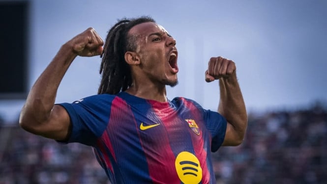 Jules Kounde luapkan kegembiraan setelah mencetak gol.