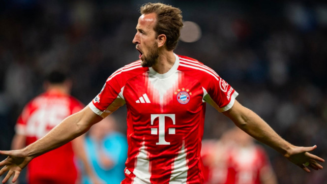 Harry Kane merayakan gol Bayern ke gawang Madrid.