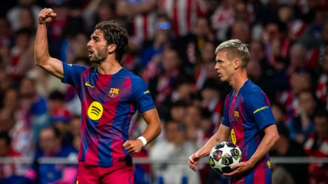 Ferran Torres merayakan gol Barcelona ke gawang Atletico Madrid.