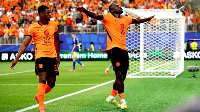 Belanda menang 3-1 atas Tunisia yang lolos ke babak 32 Besar Piala Dunia.