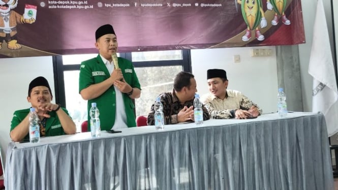 Potret ketua GP Ansor Depok HM KAhfi saat memberikan sambutan