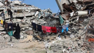 Reruntuhan bangunan di Jabalia, Jalur Gaza utara, Palestina. Reruntuhan bangunan di Jabalia, Jalur Gaza utara, Palestina.