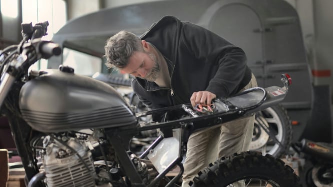 Inspecting Motorcycle