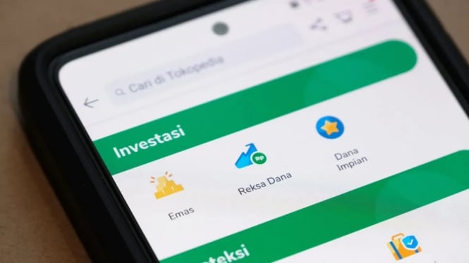 Fitur investasi emas dan reksa dana di platform Tokopedia.