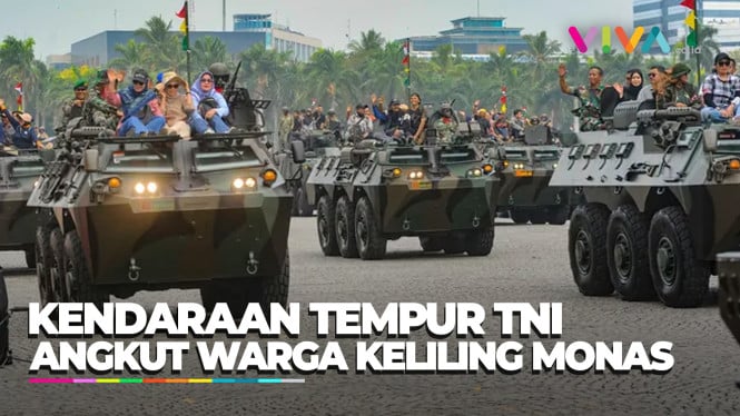 ASYIK! Sejumlah Warga Keliling Monas Naik Ranpur Bareng TNI